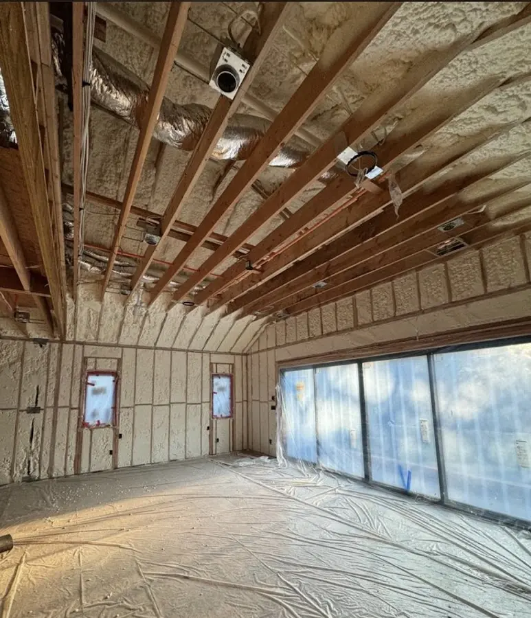 Interior walls and ceiling insulated with spray foam during new construction in Kearney